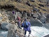 204 Jerome Ryan Crossing Miristi Khola On A Log Phuri fixed a climbing rope both ways over the log across the turbulent Miristi Khola to make it safer to cross. Jerome Ryan then took a few deep breaths and walked slowly across the log. With a sigh of relief and a smile, I thanked Phuri.